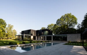Seasonal planting and lawn layout showcasing London landscape architecture techniques with beautiful outdoor pool.