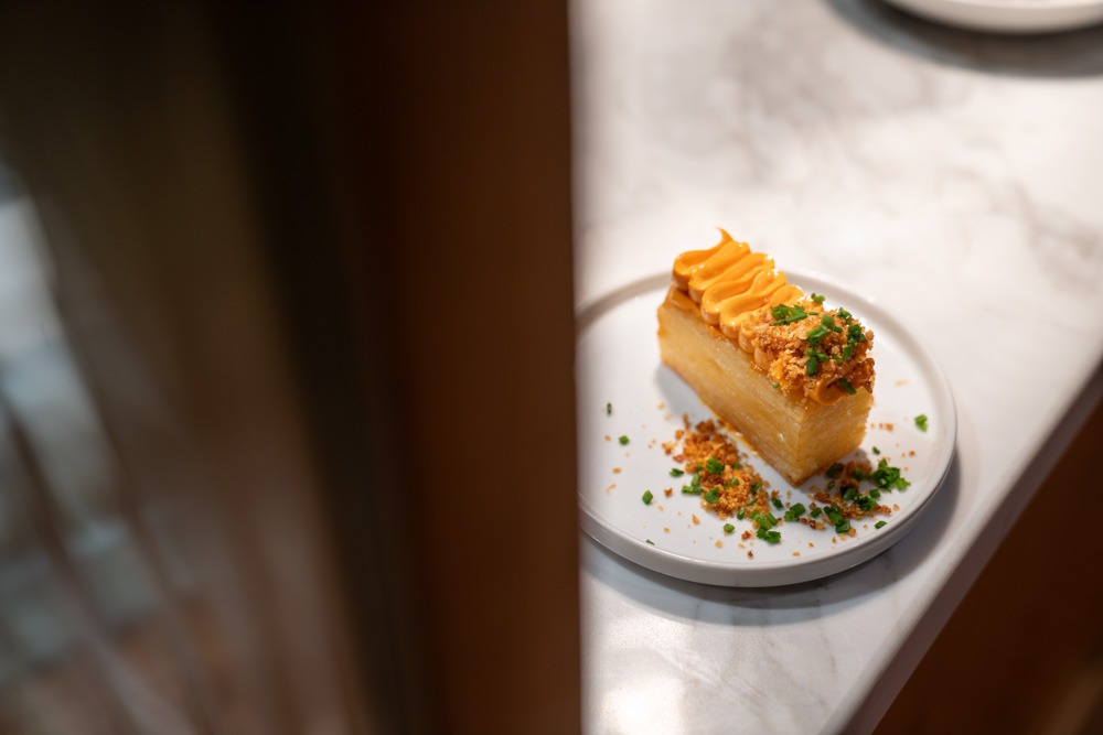 Delicious brunch dishes at Neighbourhood Café, Belfast, with open kitchen in view highlighting the top Belfast coffee shop atmosphere.