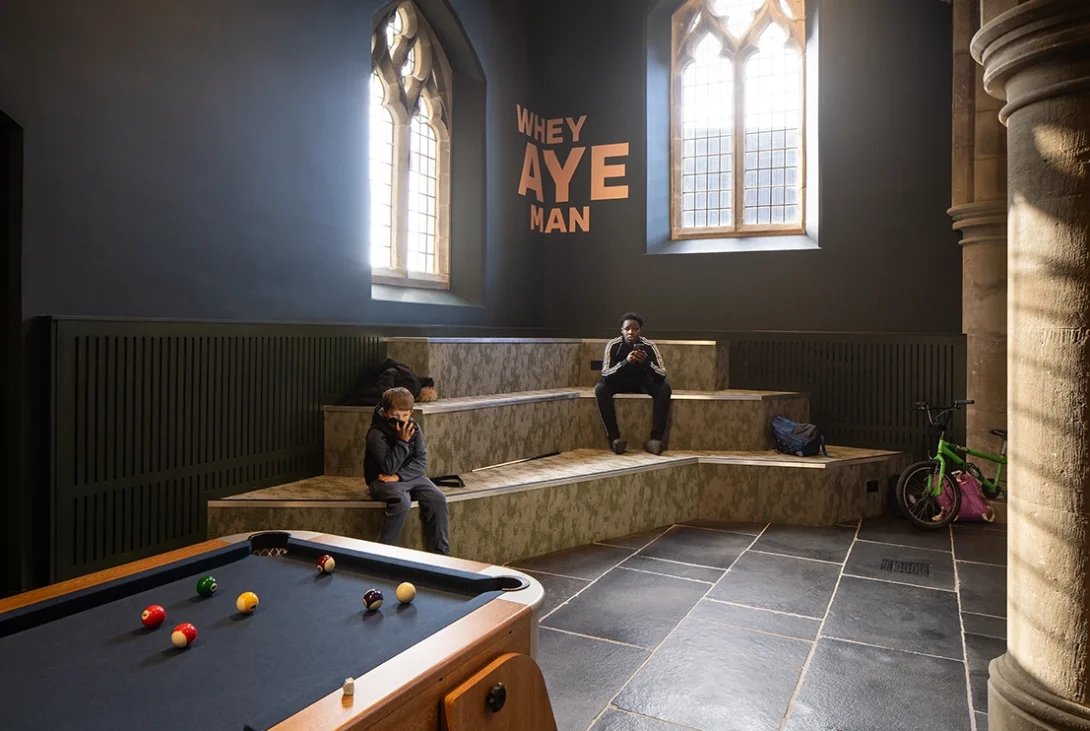Kids enjoying the multifunctional youth space inside the Lighthouse Project extension in Byker.