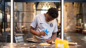 Children enjoying cooking classes in the modern annex, blending contemporary design with historic church interiors.