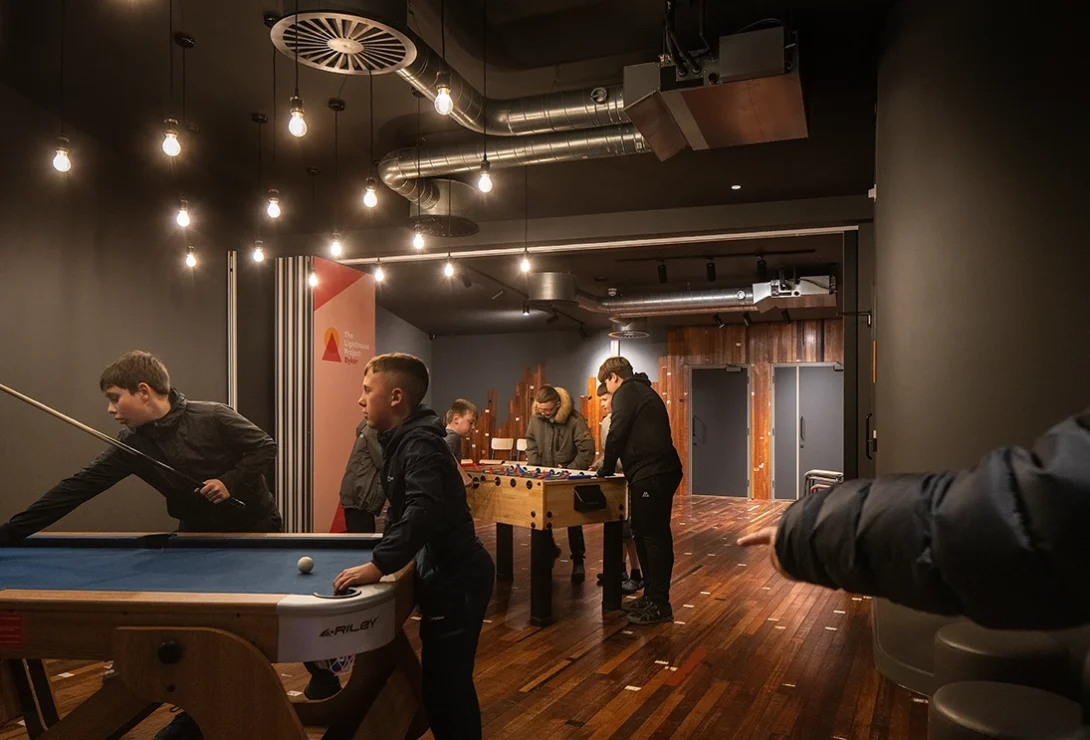 Kids playing inside the renovated St Michael’s Church, showing interactive youth and community spaces in Byker.
