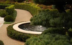 Stone and water composition showing elegant garden structure — UK landscape photography by architectural photographer.