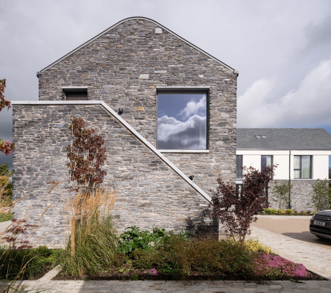 Mountjoy House exterior set within the rural landscape of Dungannon — modern Irish countryside architecture photographed in soft natural light.