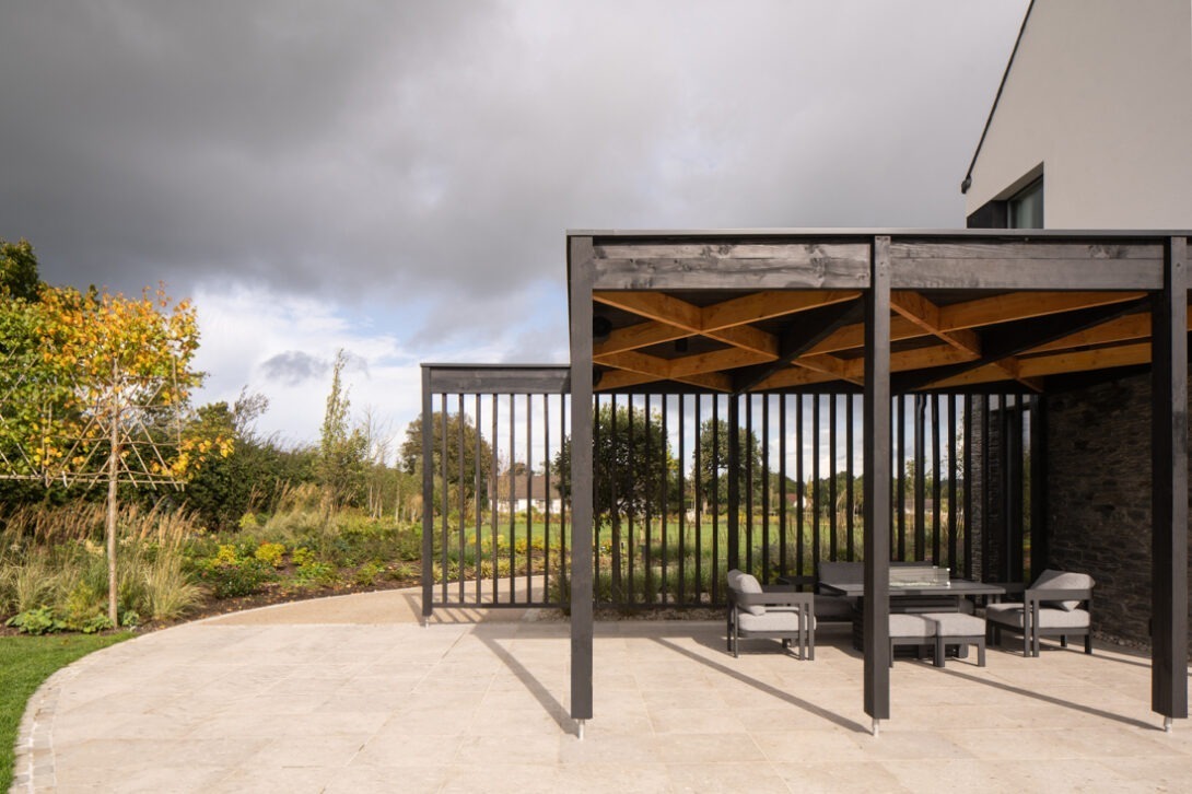 Modern family home by Nest Architects surrounded by considered landscaping at Washing Bay — UK architectural photography.