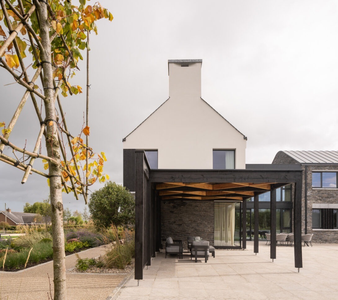 Wide view of Mountjoy House connecting architecture and countryside landscape — architectural photography by UK architectural photographer.