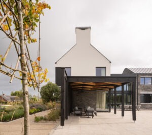 Wide view of Mountjoy House connecting architecture and countryside landscape — architectural photography by UK architectural photographer.