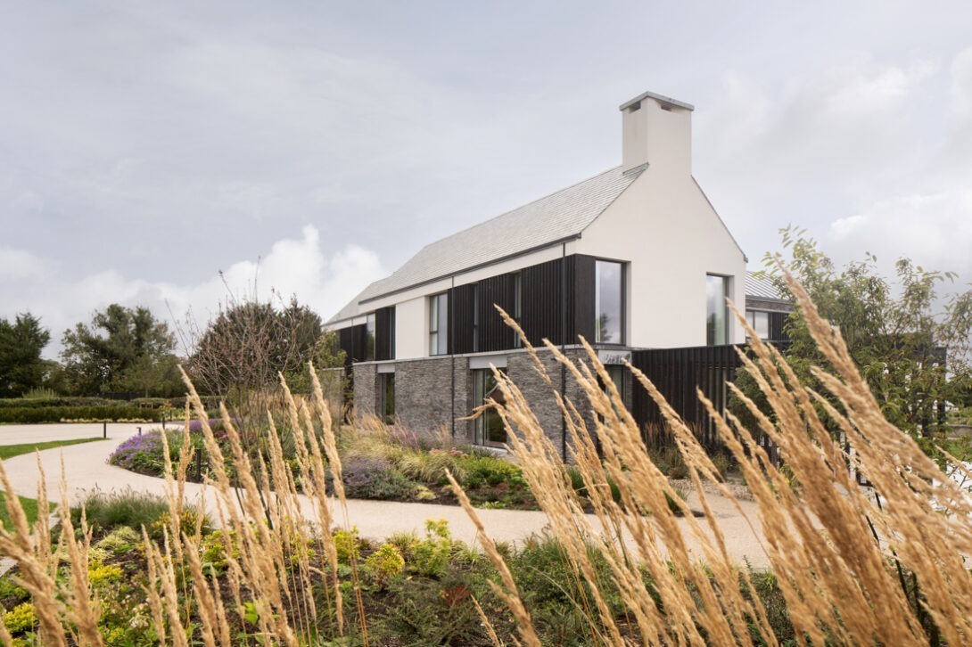 House and landscape relationship at Mountjoy House Washing Bay — contemporary countryside architecture by Nest Architects.