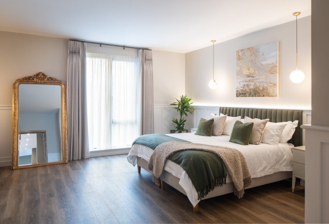 Contemporary bedroom interior with warm morning light and clean-lined detailing — The Chalet, Nest Architects.