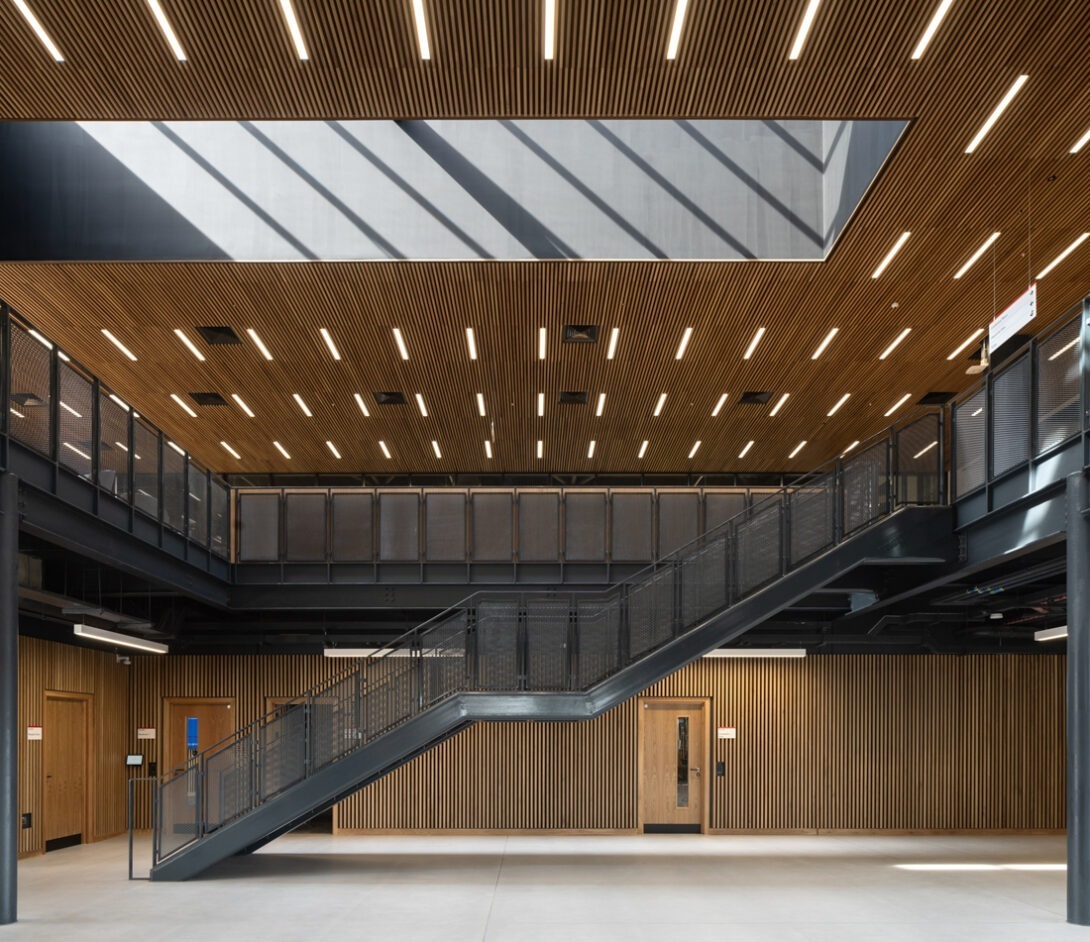 Interior view of the AMIC manufacturing facility showing advanced industrial shop floor and modern workspace design.