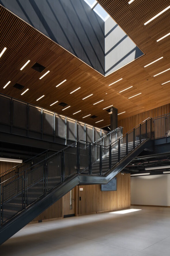 Architectural interior of AMIC highlighting premium materials, open spaces and workplace innovation.
