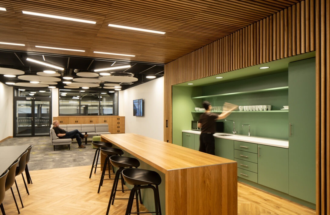 Modern meeting area within AMIC showcasing innovative workplace design and timber detailing.