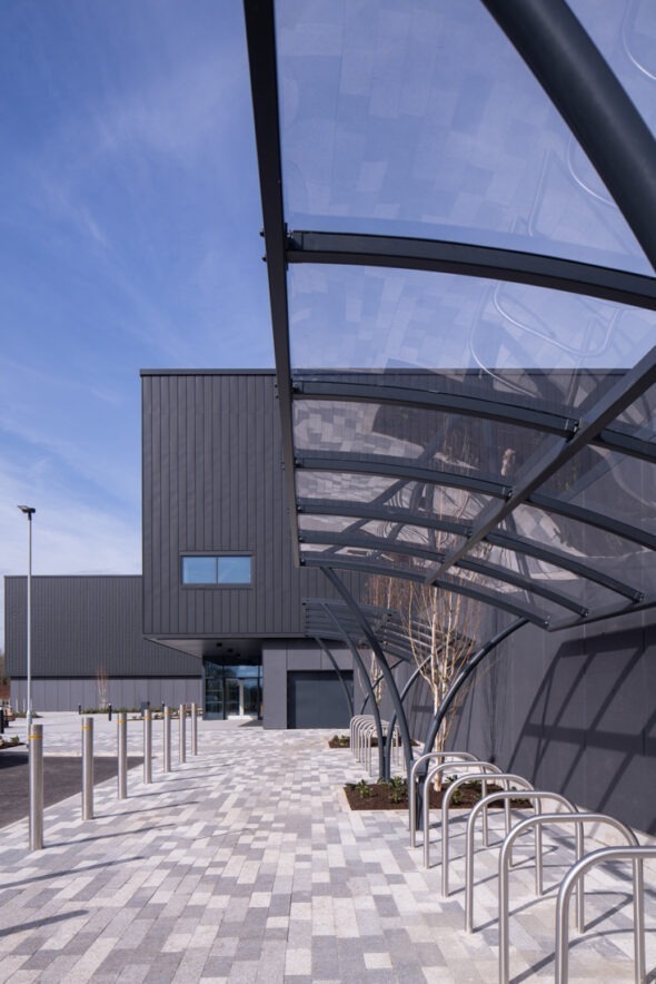 Architectural photograph of the AMIC facility highlighting its scale and contemporary façade.
